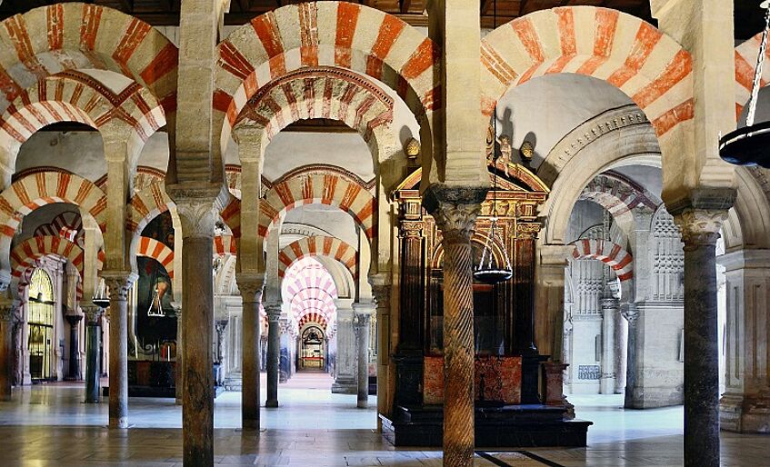 Red and white stone arches of the Mezquita-Catedral in Córdoba