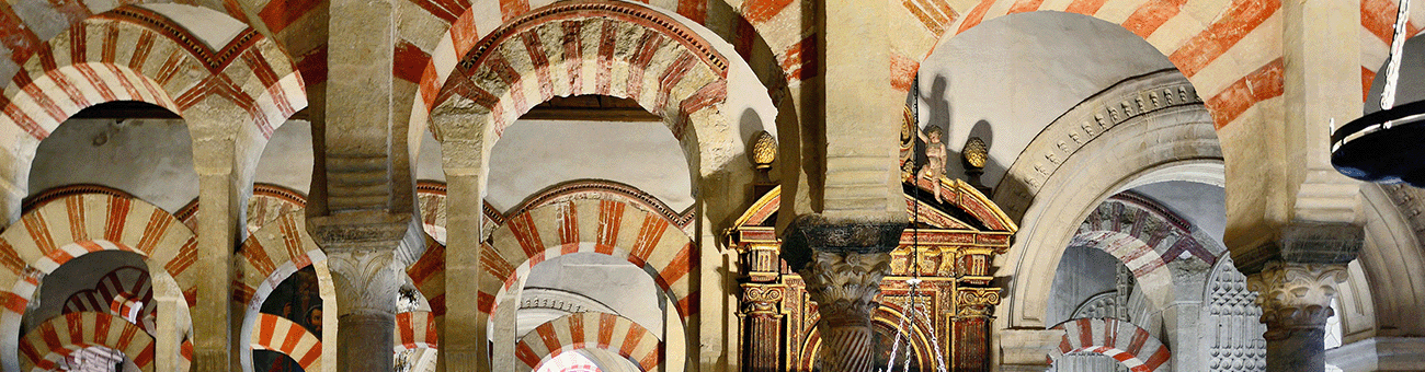 Red and white stone arch of the Mezquita-Catedral in Córdoba