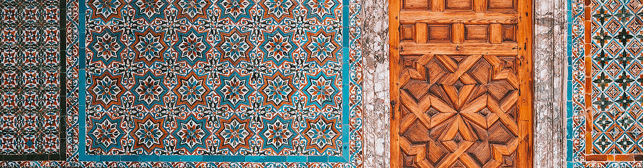 Colourful wall tiles and wooden door