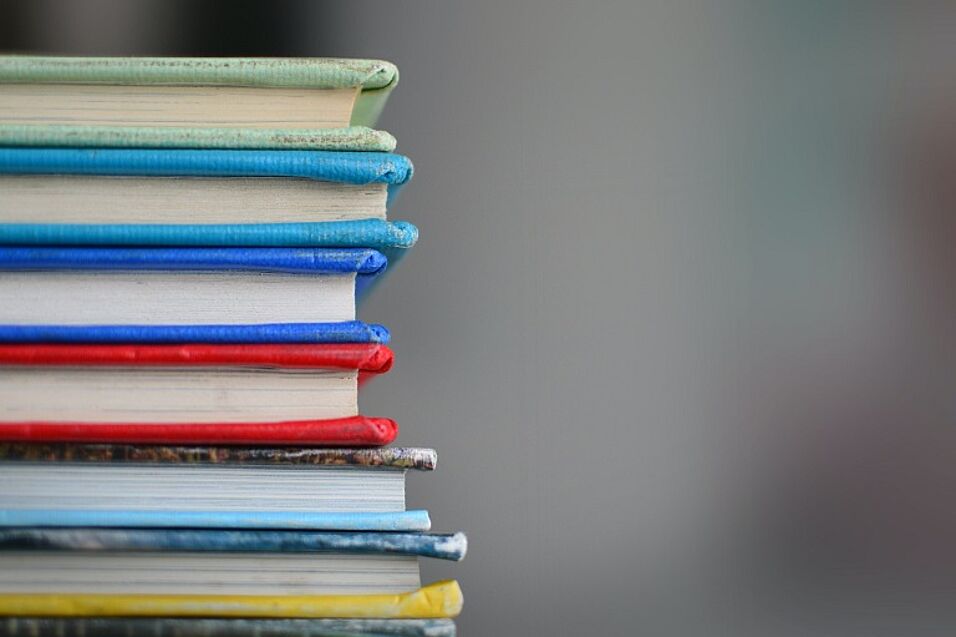 Enlarge in new tab. A stack of colourful books 